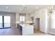 Open concept kitchen featuring white cabinets, stainless steel appliances, and a large center island at 1420 Coretta Bend, Atlanta, GA 30318