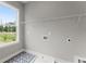 Convenient laundry room with patterned tile flooring and built-in shelving for storage and organization at 1420 Coretta Bnd, Atlanta, GA 30318