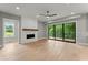 Bright living room with painted brick fireplace, and large sliding glass doors leading to the outside deck at 1420 Coretta Bnd, Atlanta, GA 30318