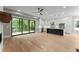 Spacious living room blends indoor comfort with outdoor views, showcasing the modern kitchen at 1420 Coretta Bnd, Atlanta, GA 30318