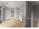 A bright room featuring a wet bar with a beverage cooler and floating shelves at 1420 Coretta Bnd, Atlanta, GA 30318