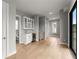 An interior space featuring a wet bar with a beverage cooler and floating shelves at 1420 Coretta Bnd, Atlanta, GA 30318
