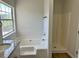 Bathroom featuring granite countertop, a soaking tub, and a shower at 3432 Sumter Pl, Decatur, GA 30034