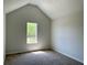 Bedroom with neutral walls, carpeted floor, and a bright window at 3432 Sumter Pl, Decatur, GA 30034