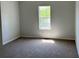 This is a bedroom with carpeted floors and a window to let in natural light at 3432 Sumter Pl, Decatur, GA 30034