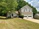 Charming two-story home with a well-maintained lawn and mature trees in a quiet neighborhood at 3432 Sumter Pl, Decatur, GA 30034