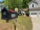 A charming home is visible past the street side mailbox for the property at 3432 Sumter Pl, Decatur, GA 30034