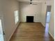 Open-concept living room featuring high ceilings, fireplace, and abundant natural light at 3432 Sumter Pl, Decatur, GA 30034