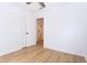 Bedroom features new wood flooring, fresh white paint, a ceiling fan, and a closet at 4215 Sherwood Ave, Decatur, GA 30035