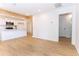 Bright and open-concept living space with hardwood floors and modern kitchen at 4215 Sherwood Ave, Decatur, GA 30035