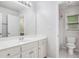 Bright, clean bathroom features a white vanity and a toilet with tiled floors at 732 Sweet Gum Way, Canton, GA 30115