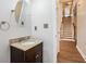 Traditional half bathroom with wood floor and a granite countertop at 732 Sweet Gum Way, Canton, GA 30115