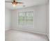 This bright bedroom gets plenty of light from its two large windows at 732 Sweet Gum Way, Canton, GA 30115