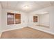 Cozy bedroom with light, carpeted floor and large mirror and access to a door at 732 Sweet Gum Way, Canton, GA 30115