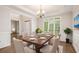 Formal dining room with wood flooring, a modern chandelier, and ample natural light at 732 Sweet Gum Way, Canton, GA 30115