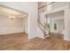 Open foyer with wood staircase and floors leading to the living spaces at 732 Sweet Gum Way, Canton, GA 30115