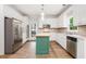 Modern kitchen with stainless steel appliances and center island with light wood countertop at 732 Sweet Gum Way, Canton, GA 30115