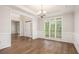 Sun-filled living room featuring wood floors and large windows with backyard views at 732 Sweet Gum Way, Canton, GA 30115