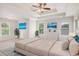 Spacious main bedroom with tray ceiling, ample natural light, and beach-themed decor at 732 Sweet Gum Way, Canton, GA 30115