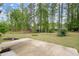 Expansive green backyard featuring mature trees and a tranquil setting at 74 Stonegate Ct, Dallas, GA 30157