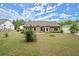Wide shot of the backyard showing a grassy area and the house's exterior at 74 Stonegate Ct, Dallas, GA 30157