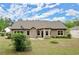 Wide shot of the backyard showing the house's exterior at 74 Stonegate Ct, Dallas, GA 30157