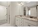 Bathroom featuring double vanity with granite countertops, walk-in closet, and lots of natural light at 74 Stonegate Ct, Dallas, GA 30157