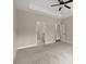 Neutral bedroom with en-suite bathroom and a glimpse of a walk-in closet at 74 Stonegate Ct, Dallas, GA 30157