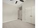 Bright, neutral bedroom with a ceiling fan and closet space, offering comfortable living at 74 Stonegate Ct, Dallas, GA 30157