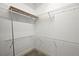 Walk-in closet equipped with wire shelving and a wooden top shelf for functional storage solutions at 74 Stonegate Ct, Dallas, GA 30157