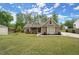 Inviting single-story home with a green lawn, showcasing a well-maintained exterior and cozy curb appeal at 74 Stonegate Ct, Dallas, GA 30157