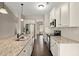 A full kitchen featuring stainless steel appliances, granite countertops and hardwood floors at 74 Stonegate Ct, Dallas, GA 30157