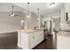 Kitchen island featuring granite countertops and stainless steel appliances with hardwood floors at 74 Stonegate Ct, Dallas, GA 30157