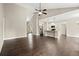 Bright living room featuring hardwood floors, an open layout, and a seamless transition to the modern kitchen at 74 Stonegate Ct, Dallas, GA 30157