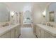 Primary bathroom with double vanity sinks, stand alone tub and walk-in shower at 1725 Redbud Way, Cumming, GA 30041