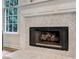 Close-up of the living room fireplace with herringbone pattern at 1725 Redbud Way, Cumming, GA 30041
