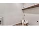 Convenient laundry room with shelf, wood floors, and ample room for cleaning at 1725 Redbud Way, Cumming, GA 30041