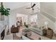 Living room with fireplace, staircase, hardwood floors, and vaulted ceiling at 1725 Redbud Way, Cumming, GA 30041