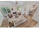 Living room with hardwood floors, fireplace, and a view of the kitchen and eating area at 1725 Redbud Way, Cumming, GA 30041