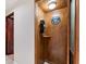 Nostalgic wooden phone booth with a classic rotary phone, a unique and decorative feature for the home at 1725 Redbud Way, Cumming, GA 30041
