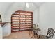 Charming wine cellar featuring tile floor, unique wine rack, and table for a cozy tasting experience at 1725 Redbud Way, Cumming, GA 30041