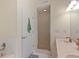 Bathroom featuring double sinks and a tiled shower with glass doors at 221 Ashford Cir, Atlanta, GA 30338