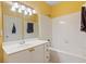Bright bathroom featuring a vanity with gold hardware, shower and toilet at 221 Ashford Cir, Atlanta, GA 30338