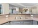 Close-up of kitchen bar area, cabinets, sink, faucet and quartz countertop at 221 Ashford Cir, Atlanta, GA 30338