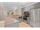 Well-lit kitchen with stainless steel appliances and gray cabinets at 221 Ashford Cir, Atlanta, GA 30338