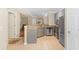 Bright kitchen with stainless steel appliances, tile flooring, and gray cabinetry at 221 Ashford Cir, Atlanta, GA 30338