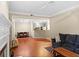 Open-concept living area showcases hardwood floors and seamless transition to dining and kitchen spaces at 221 Ashford Cir, Atlanta, GA 30338