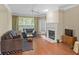 Inviting living room features a cozy fireplace and ample seating at 221 Ashford Cir, Atlanta, GA 30338