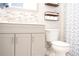 Bathroom features modern vanity with a stylish mosaic tile backsplash, offering a clean, fresh, and inviting space at 2568 Morning Glory Pl, Lawrenceville, GA 30044