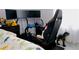 room includes bed, monitors, video game driving set, plush toys, and fun decorations at 2568 Morning Glory Pl, Lawrenceville, GA 30044